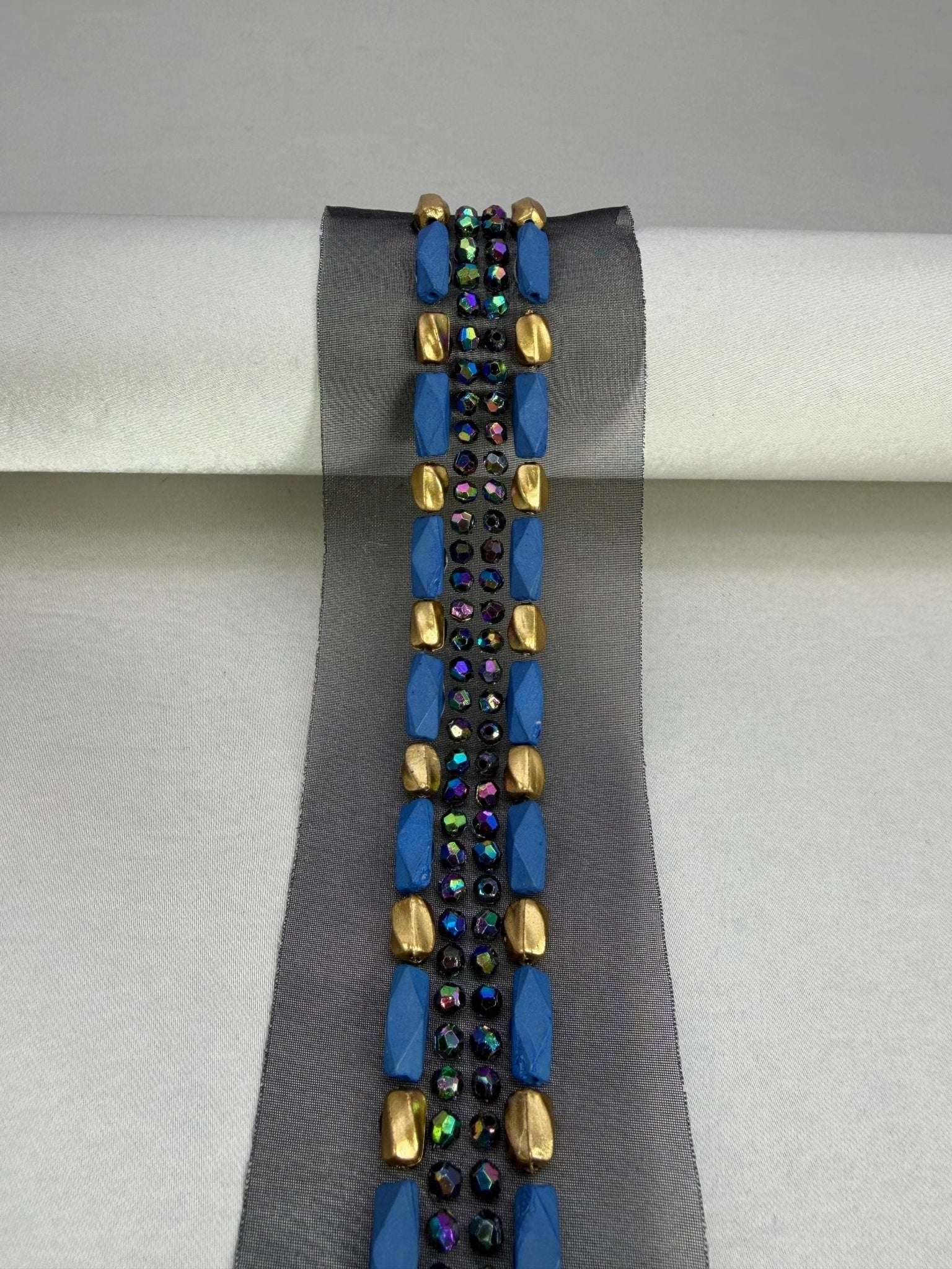 Iridescent Beads Bordered with matt Gold and Blue Beads with AB blue beads in center on DIY Self Adhesive Trim - Faraj Beading